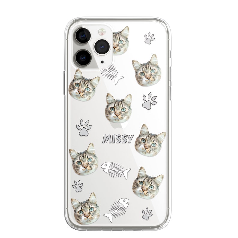 May include: Clear phone case with a repeated pattern of a cat's face, a fish bone, and a paw print. The text "MISSY" is printed on the case.