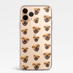May include: A clear phone case with a repeating pattern of a brown dog's face. The case is designed for an iPhone with a triple lens camera.