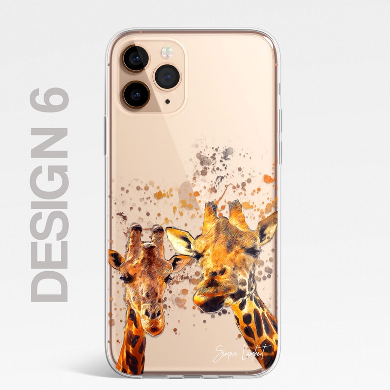 May include: A clear phone case with a gold background and a watercolor design of two giraffes looking up. The giraffes are painted in shades of brown, orange, and yellow. The case has a clear back and a black camera cutout.