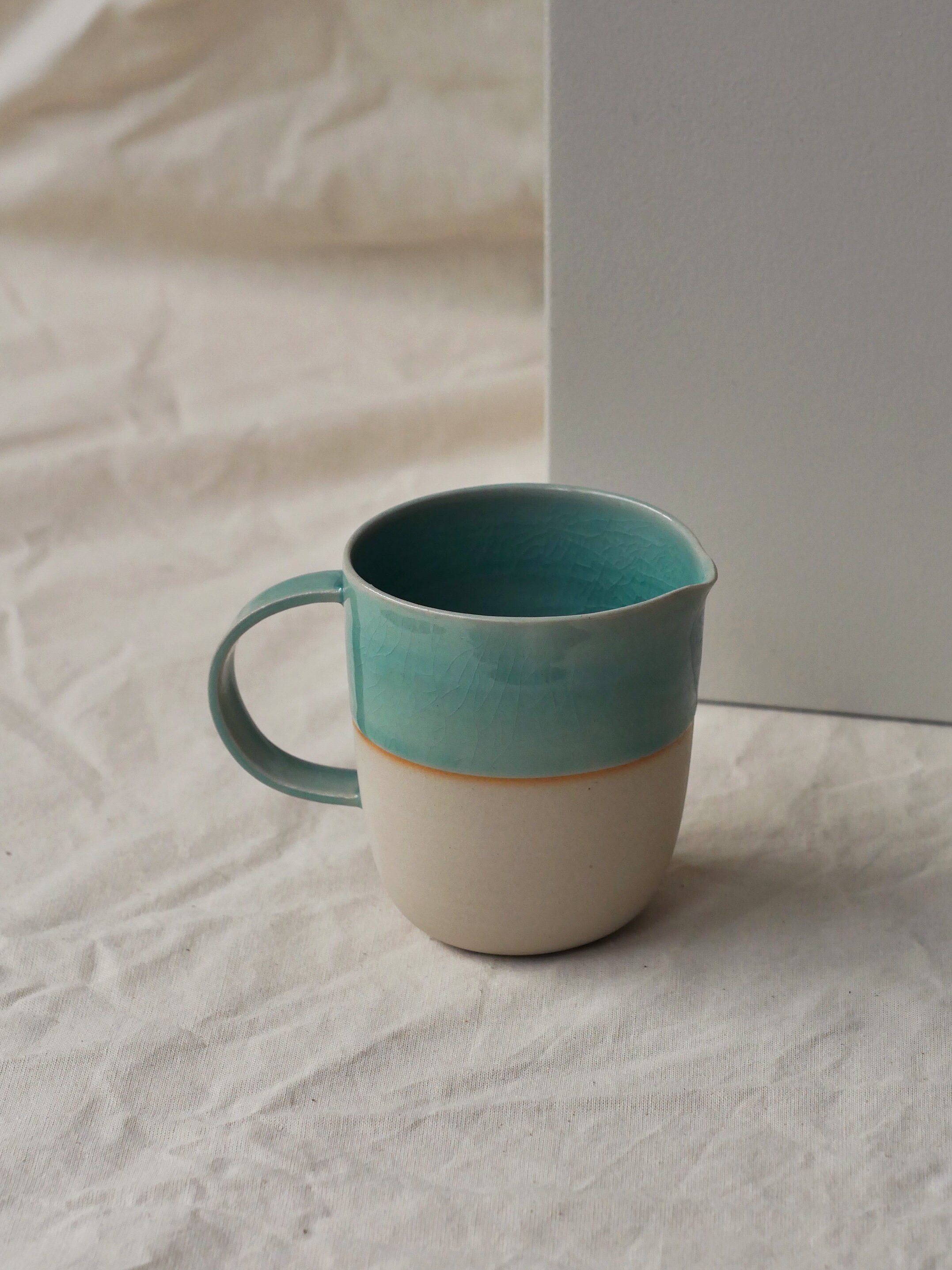 Artisanal enameled stoneware milk jug