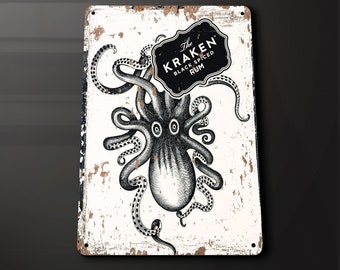 May include: A white metal sign with a distressed, aged look. The sign features a black and white illustration of an octopus with the text "The Kraken Black Spiced Rum" in a black oval.