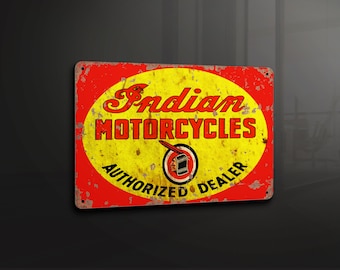 May include: A vintage-style metal sign with a red background and a yellow circle in the center. The circle features the text "Indian Motorcycles Authorized Dealer" in a black font. The sign has a distressed look with visible rust and wear.