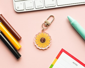 Llavero con diseño de girasol y discapacidades invisibles, con amuleto de neurodiversidad