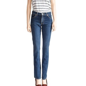 May include: A white striped t-shirt with a blue and white striped pattern and a pair of blue denim jeans.