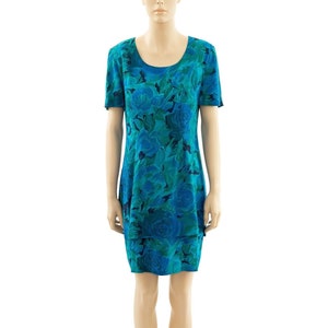 May include: A blue and green floral print short-sleeved dress with a scoop neck.
