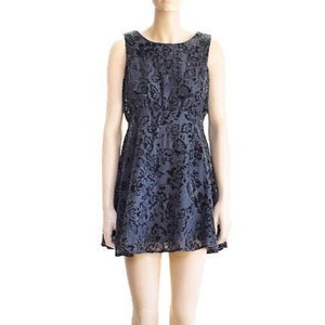 May include: A sleeveless, knee-length, black and gray floral print dress with a fitted bodice and a flared skirt.