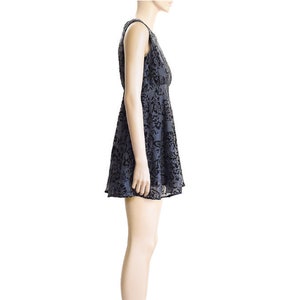 May include: A sleeveless, knee-length dress with a black floral pattern on a gray background. The dress has a fitted bodice and a flared skirt.