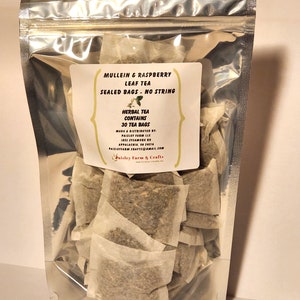 May include: A silver resealable bag filled with 30 individual tea bags of Mullein & Raspberry Leaf Tea. The tea bags are sealed and have no string. The label reads "Herbal Tea Contains 30 Tea Bags" and "Mullein & Raspberry Leaf Tea Sealed Bags - No String".