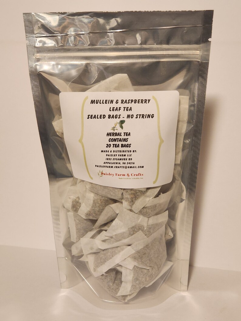 May include: A clear plastic bag filled with 20 individual tea bags containing a blend of mullein and raspberry leaf tea. The label reads "Mullein & Raspberry Leaf Tea, Sealed Bags - No String, Herbal Tea Contains 20 Tea Bags, Made & Distributed by Paisley Farm LLC, 1852 Sycamore Rd, Appalachia, VA 24216, Paisleyfarm.Crafts@gmail.com, Paisley Farm & Crafts".