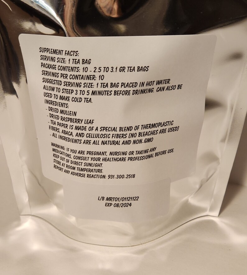 May include: White label with black text listing supplement facts for a tea bag. Serving size is 1 tea bag, package contents are 10 tea bags, and servings per container are 10. Suggested serving size is 1 tea bag placed in hot water. Allow to steep 3 to 5 minutes before drinking. Can also be used to make cold tea. Ingredients include dried mullein, dried raspberry leaf, and tea paper made of a special blend of thermoplastic fibres, abaca, and cellulosic fibres. All ingredients are all natural and non-GMO. Warning: If you are pregnant, nursing, or taking any medications, consult your healthcare professional before use. Keep out of direct sunlight. Store at room temperature. Report any adverse reaction: 931.300.2518. L/B MRT01/01121122 EXP 08/2024.