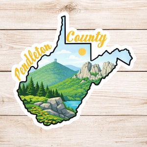May include: A sticker in the shape of West Virginia, featuring a scenic landscape of Pendleton County. The design includes green hills, a lake, and the text "Pendleton County" in yellow.