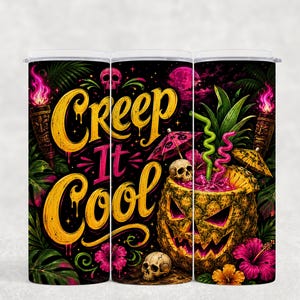 May include: A cylindrical tumbler featuring a black background with the yellow text Creep It Cool. The design includes a carved pineapple jack-o'-lantern, skulls, pink hibiscus flowers, tiki torches with pink flames, and tropical foliage.