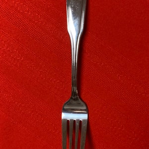 1 Rogers antique shell stainless steel salad fork