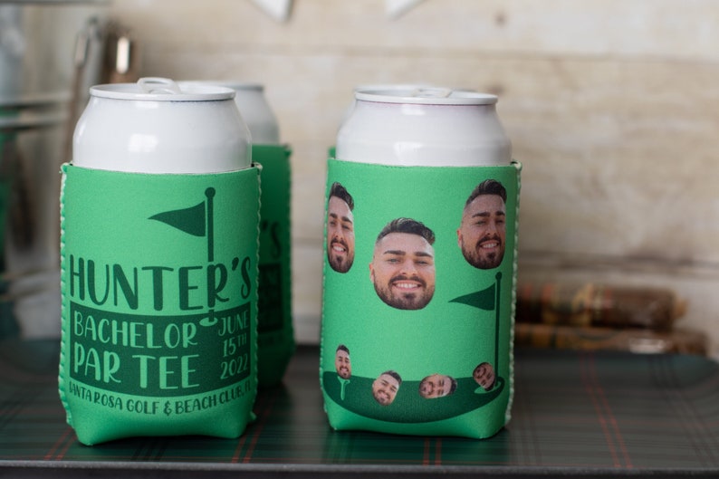May include: Green and white can cooler with a golf course design. The cooler has a photo of a man on it and the text "Hunter's Bachelor Par Tee June 15th 2022 Santa Rosa Golf & Beach Club".