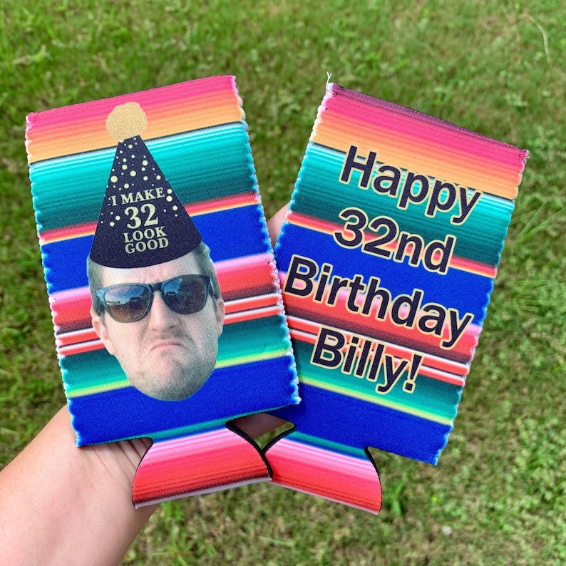 May include: Two colorful can coolers with a Mexican serape pattern. One cooler has a photo of a man wearing a party hat that says "I make 32 look good". The other cooler says "Happy 32nd Birthday Billy!"