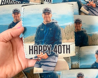 May include: A white can cooler with a photo of a person fishing. The text "HAPPY 40TH" is printed on the cooler.