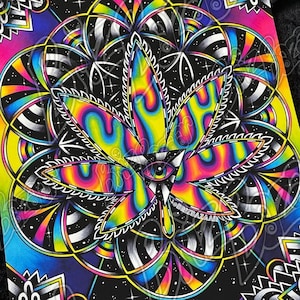 May include: A psychedelic print of a marijuana leaf with a third eye in the center, surrounded by a colorful mandala design on a black background.