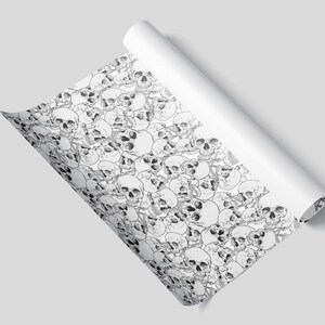 A sheet of wrapping paper featuring skulls
