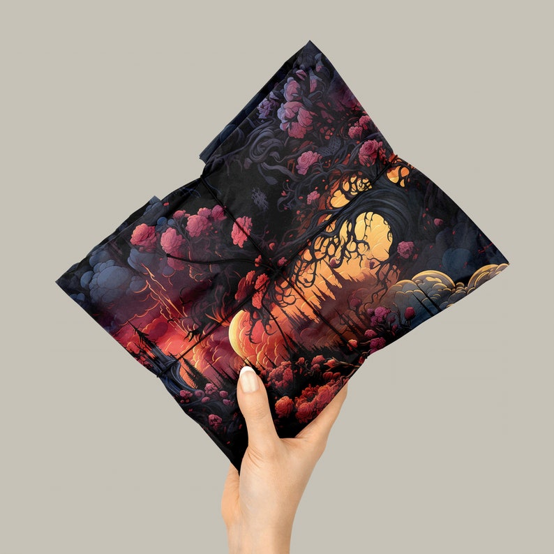 Wrapping paper with a surreal flower, tree and cloud image, wrapping a gift with black string held in one hand