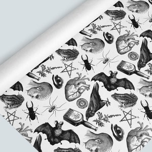 Monochrome witch craft artwork on wrapping paper roll