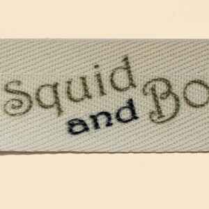 Detailed view of a printed twill tape labels for sewing onto clothing
