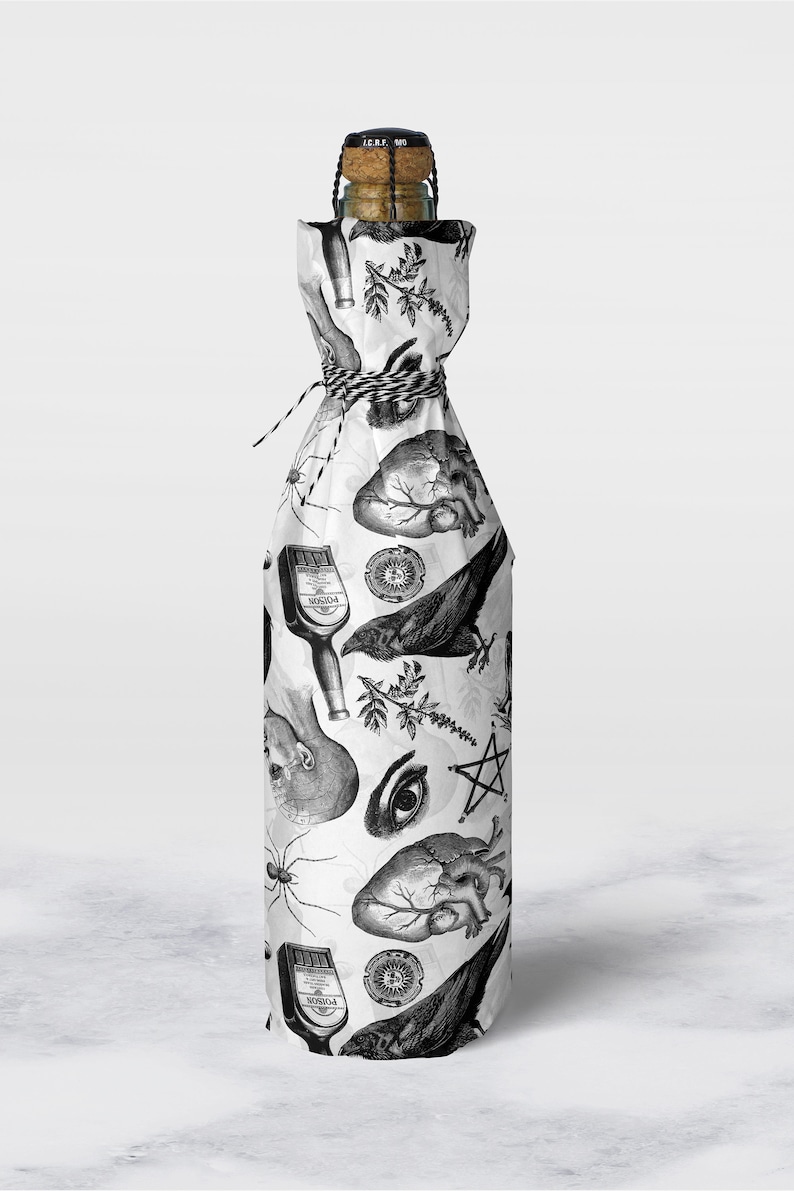 Monochrome witch craft artwork on tissue paper wrapping a bottle