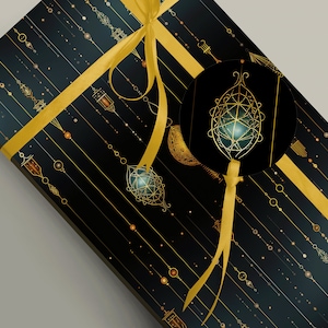 May include: A black gift box with a gold ribbon and a geometric design. The box is decorated with gold ornaments and a gold circle with a geometric design.