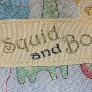 Printed twill tape labels sewn onto childs clothing