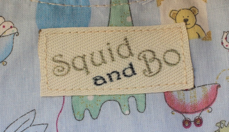 Printed twill tape labels sewn onto childs clothing
