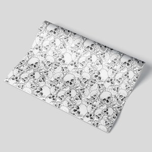 A sheet of wrapping paper featuring skulls