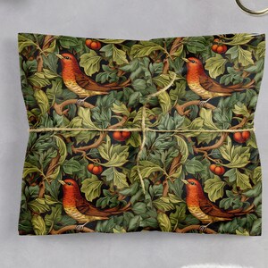 Holiday Wrapping Paper: Holly, Ivy, and Robin Pattern around a gift with twine to secure
