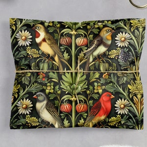 May include: A black and green wrapping paper with a repeating pattern of birds and flowers. The birds are red, yellow, and blue. The flowers are white and pink.