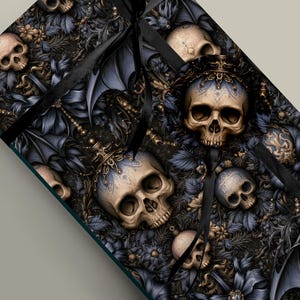 Paquete de papel de regalo navideño con adornos de calaveras góticas