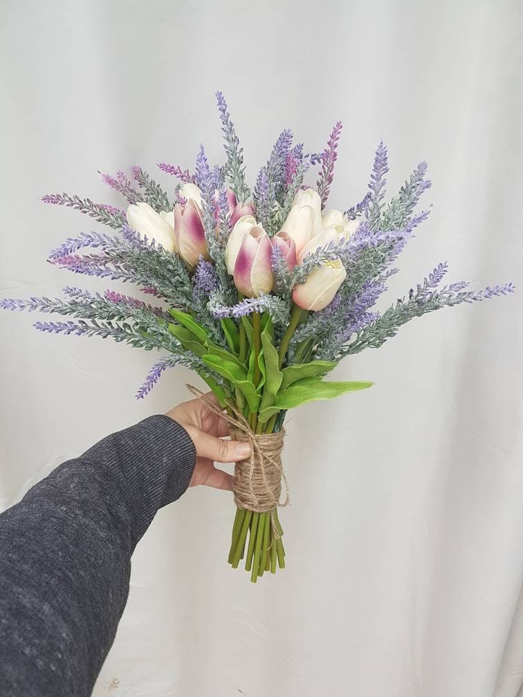 A Beautiful Bouquet of Lilac Tulips with Natural Stones of
