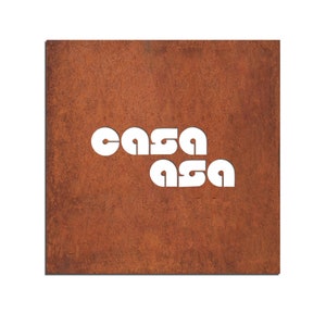 May include: A rusty metal sign with the word "casa" cut out in white letters.