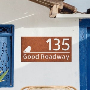 Custom corten steel signboard with house number and street name with small cute bird decoration