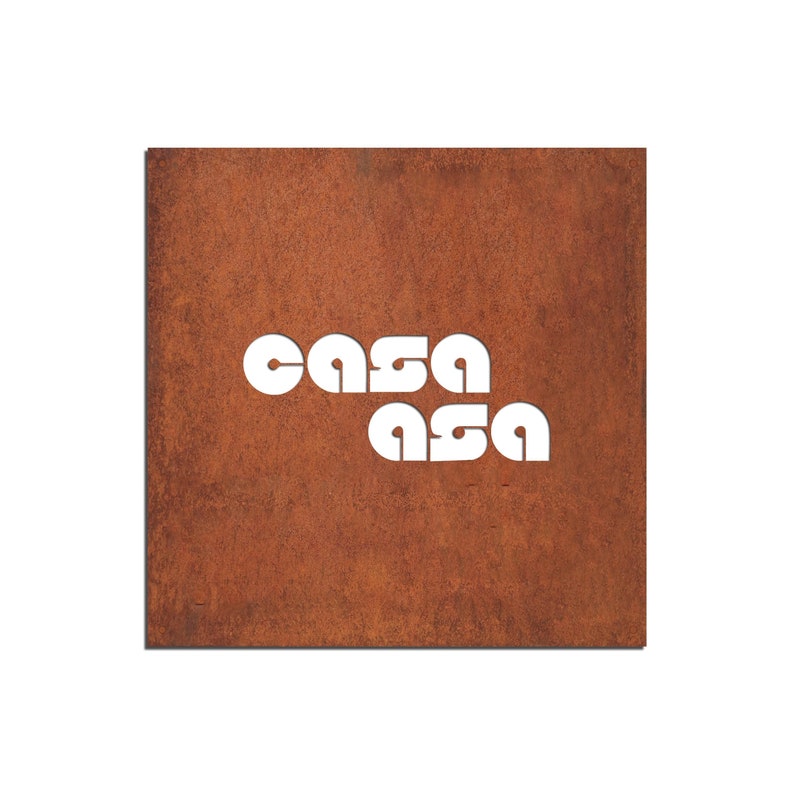 May include: A rusty metal sign with the word "casa" cut out in white letters.