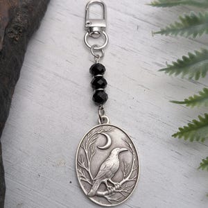 May include: A set of three ceramic mugs with a speckled, matte finish. The mugs are in shades of cream, light gray, and dark gray. Each mug has a simple, minimalist design, perfect for coffee or tea.