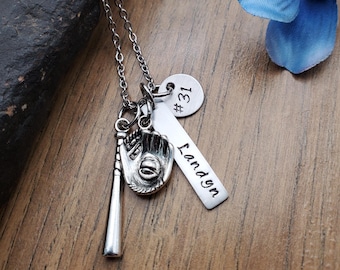 May include: Silver necklace with a baseball bat, glove, and ball charm. The necklace also has a silver tag with the name "Landyn" and a silver tag with the number "#31" on it.