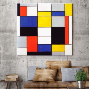 May include: Abstract painting with a grid of squares in black, white, red, yellow, and blue. The painting is framed and hanging on a concrete wall.