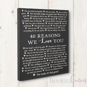 May include: A black canvas print with white text that reads "40 Reasons We Love You" and lists 40 reasons why someone is loved. The text is in a heart shape.