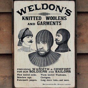 Distressed wooden sign &#39; Weldon&#39;s Knitted Woolens &#39; original design concept.