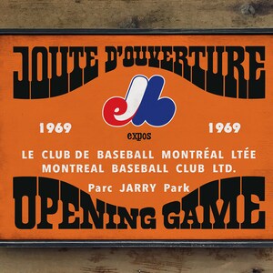 May include: A vintage orange and black sign with the text "JOUTE D'OUVERTURE" and "OPENING GAME". The sign also features the Montreal Expos logo and the years "1969" and "1969".