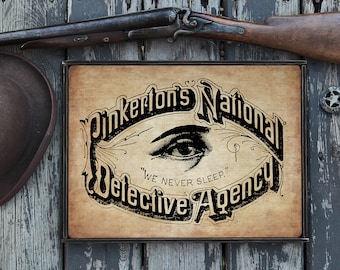 Vintage wooden sign 'Pinkerton's National Detective Agency'