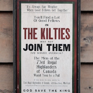 May include: A vintage wooden sign with red, white, and green paint. The sign advertises the 73rd Royal Highlanders of Canada, encouraging people to "Join Them" for service overseas. The sign includes the text "It's Always Fair Weather When Good Fellows Get Together" and "God Save The King".