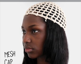 May include: A cream-coloured crochet mesh cap featuring a grid-like pattern. The text CROCHET PATTERN is displayed at the top, while MESH CAP and @MARVESnewyork are printed on the lower left side of the image.