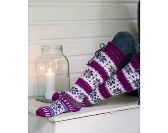 May include: A pair of long, knitted socks with a white and purple geometric pattern. The socks are tied at the top with a white ribbon.
