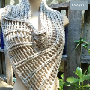 May include: A beige crochet scarf with a geometric pattern and colorful flecks. The scarf is displayed on a mannequin against a wooden fence. The text "Akira Scarf PDF PATTERN" is at the bottom of the image.