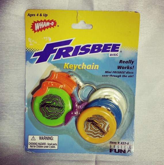 This is a vintage 1999 Basic Fun Wham-O Frisbee ke