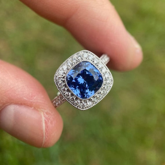 14K White Gold 7mm Cushion Cut Created Blue Sapphire & Diamond Halo Ring 14K White Gold 7mm Cushion Cut Created Blue Sapphire & Diamond Halo Ring